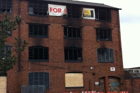 Old factory building with fire damage